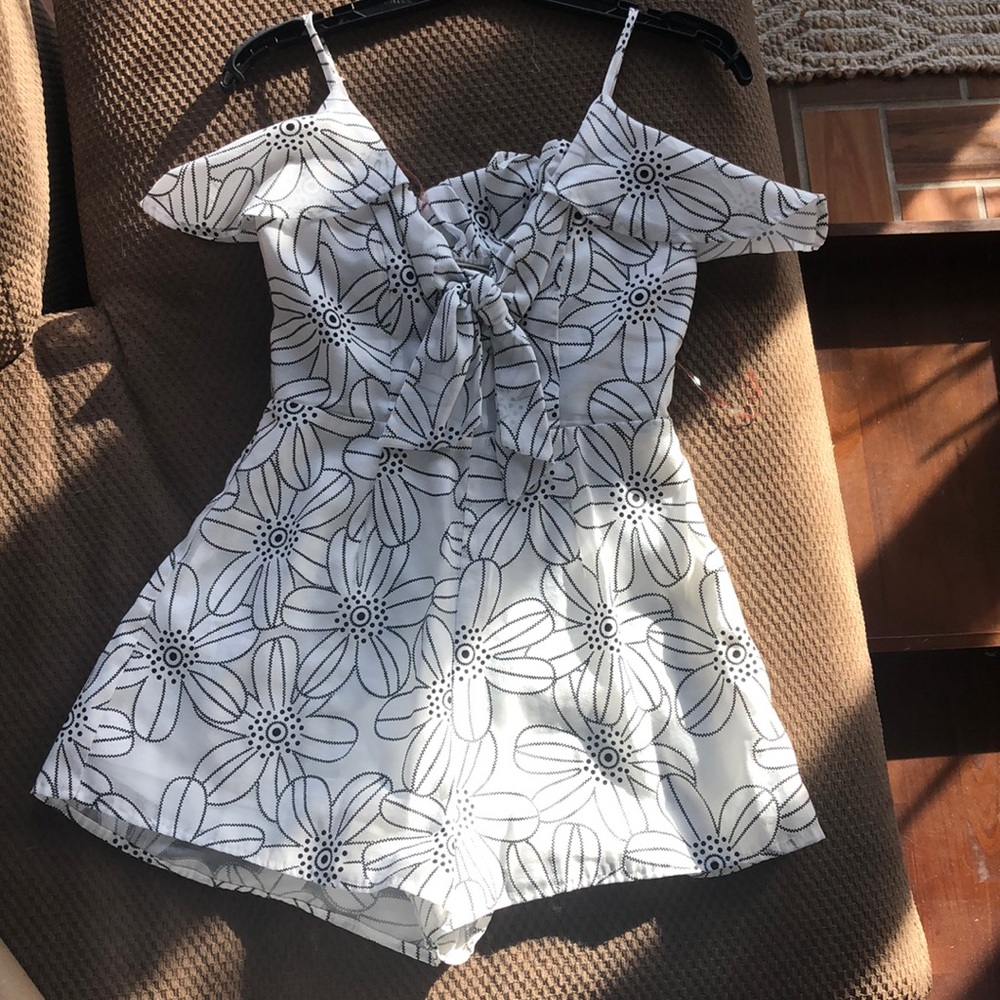 white romper with black flowers